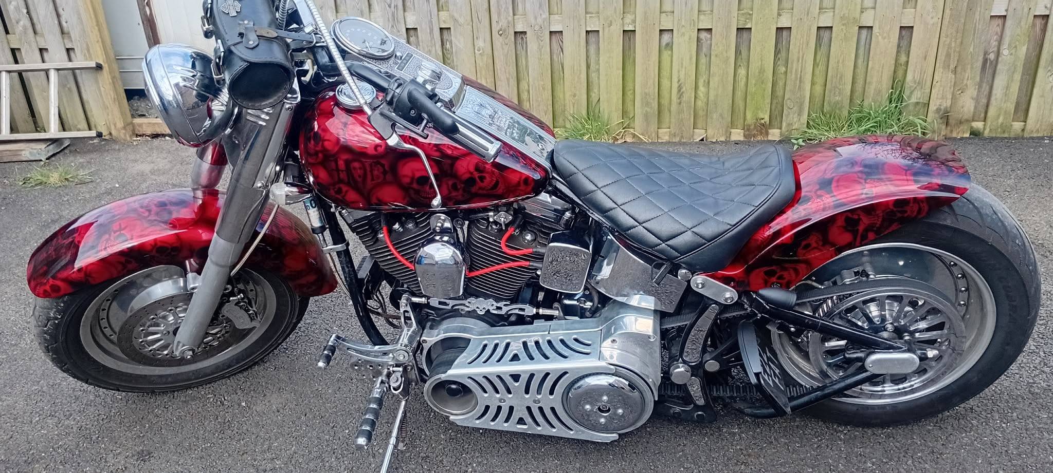 Red skull airbrush artwork on a Harley-Davidson tank