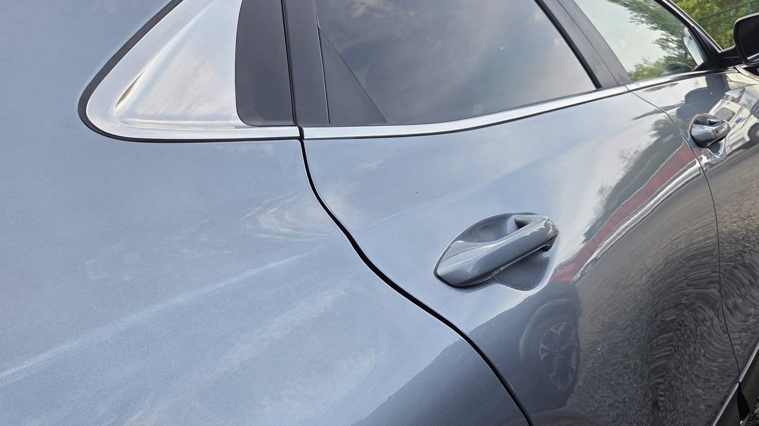 Freshly refinished car panel with a deep gloss finish