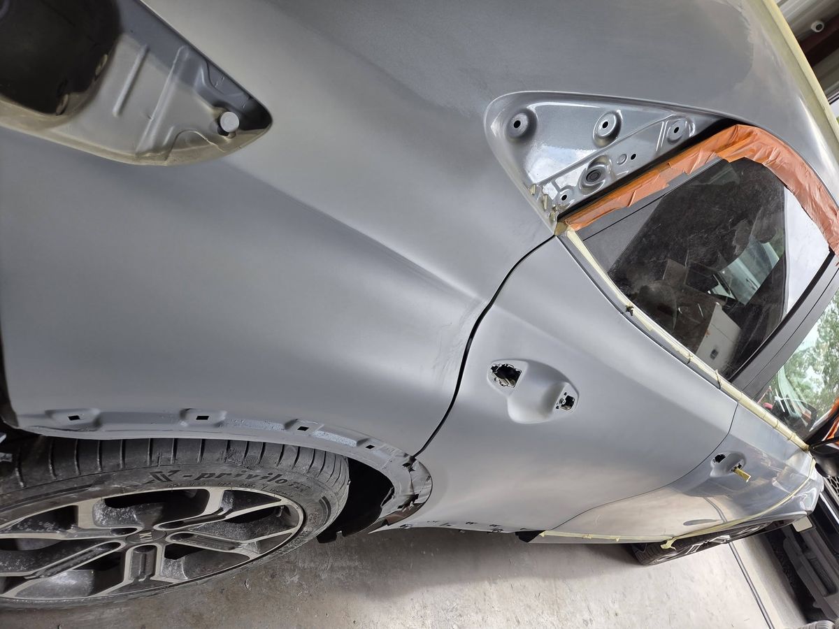 Rear quarter panel in primer, mid-repair