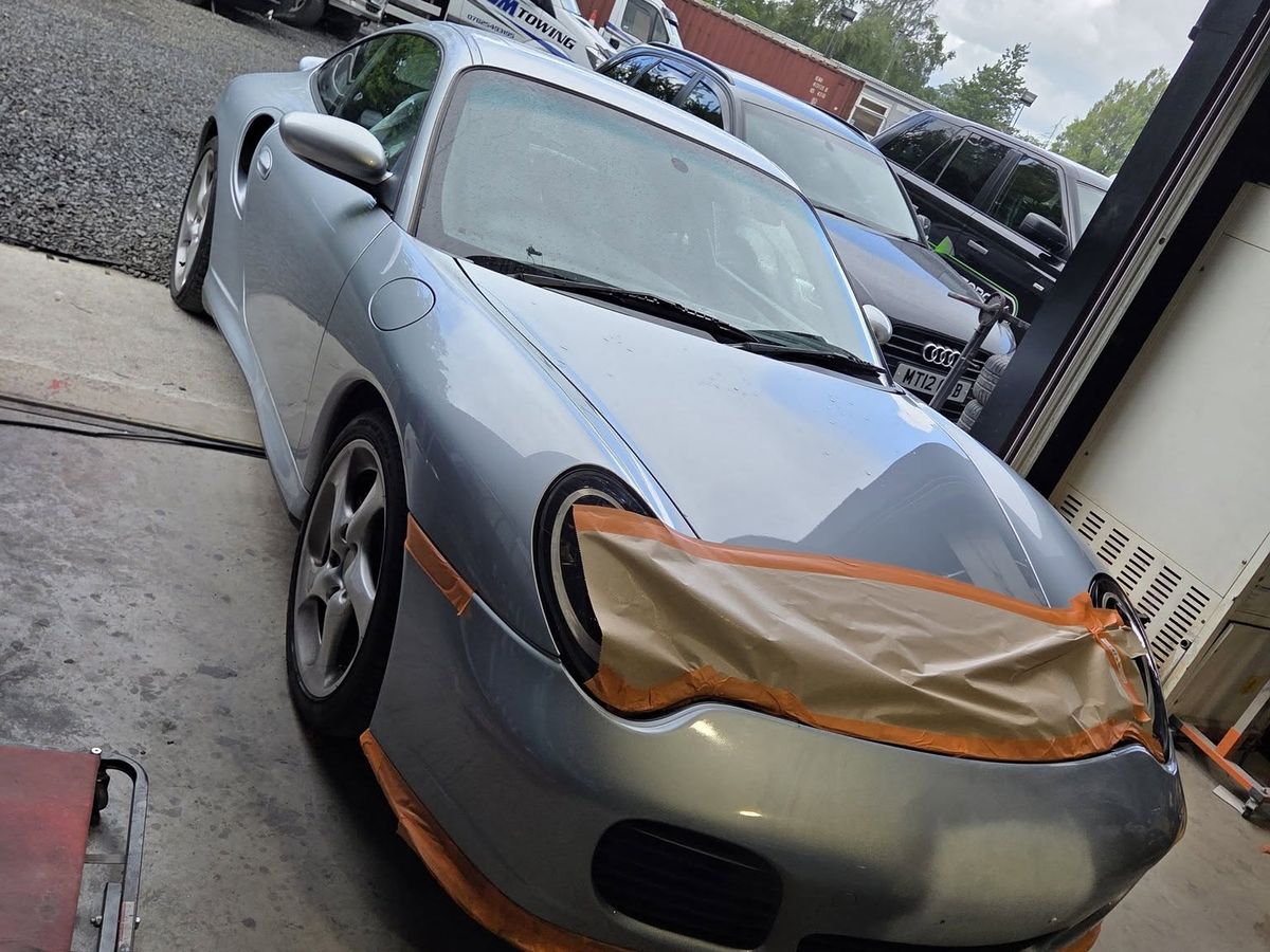 Porsche 911 masked up for front end refinishing